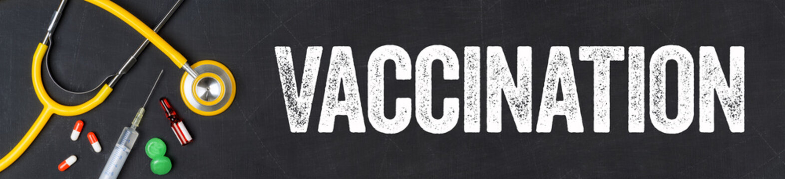  Stethoscope and pharmaceuticals on a blackboard - Vaccination