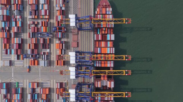 Top down aerial view of container ship loading at hai phong port