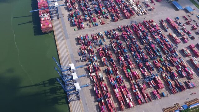 Aerial view flying over industrial container port in hai phong