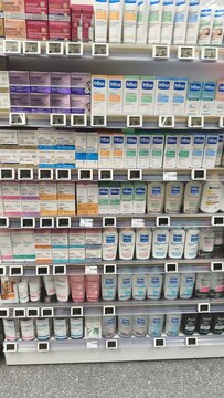 Royan, France - July 25, 2026: E.Leclerc ROYAN CEDEX. Shelves filled with various skincare products in a retail store, featuring brands like Neutrogena and Cetaphil clearly visible