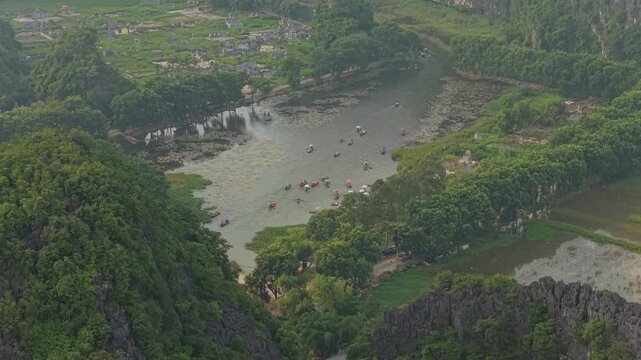 Tourists traveling by boat on tam coc river in ninh binh
