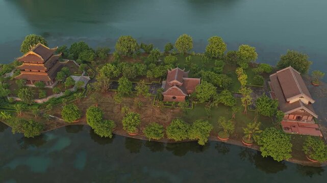 Aerial view of golden pagoda island during sunrise in hoa lu, vietnam