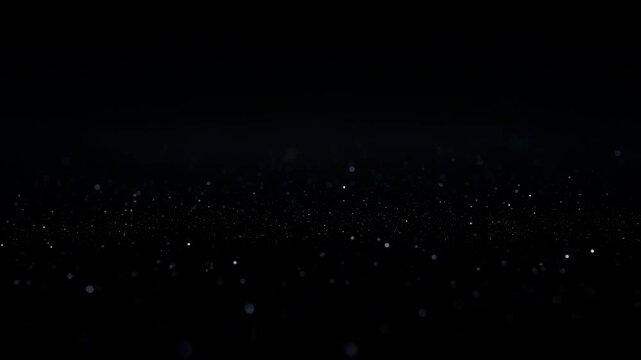 Intentionally blurred glowing particles drift through a dark atmospheric field. Cinematic title, technology presentation, and abstract motion graphics.