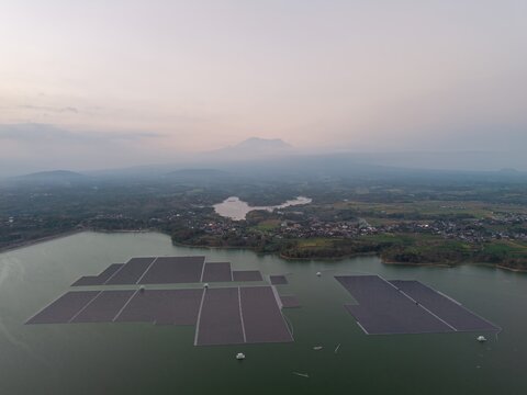 Floating solar panels glide across tranquil lake waters at East Java