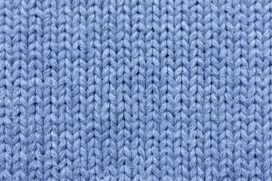 soft periwinkle blue knitted wool texture with prominent purl loops and cool lavender blue undertones
