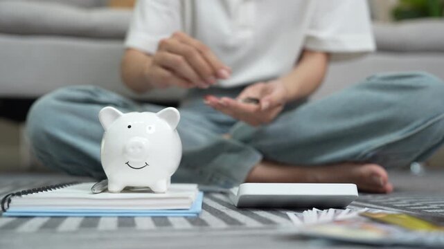 A woman holds a piggy bank, which symbolizes savings, financial planning, and economic challenges. Budgeting, investing, and money management for a secure future.