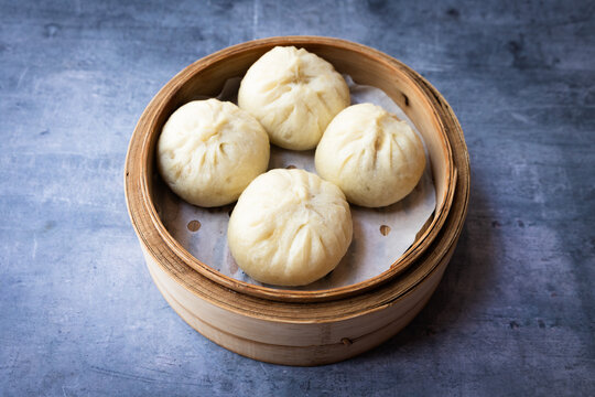Traditional Chinese Steamed Buns in Bamboo Basket
