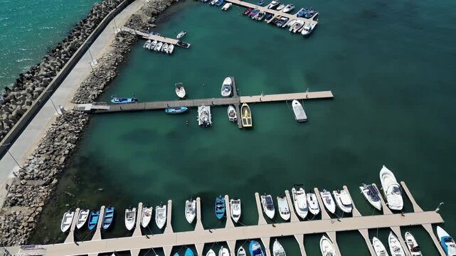 Aerial View of Marina Harbor with Boats and Yachts in Turquoise Sea Water