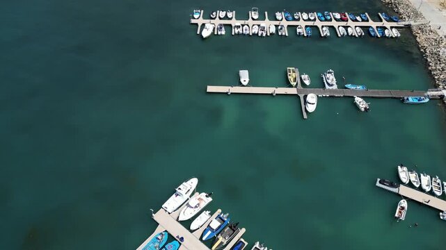 Aerial View of Marina Harbor with Boats and Yachts in Turquoise Sea Water