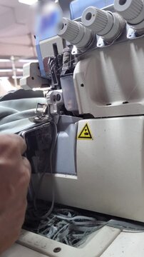 Close Up of Digital Overlock Machine Sewing Fabric