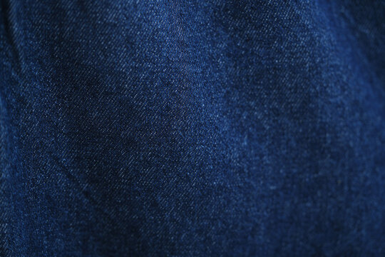Blue denim jeans texture as background. close up, macro. concept business, shopping, sale. Design detail, copy space	
