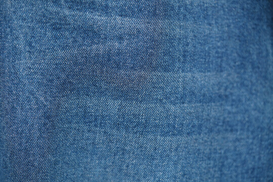 Blue denim jeans texture as background. close up, macro. concept business, shopping, sale. Design detail, copy space	

