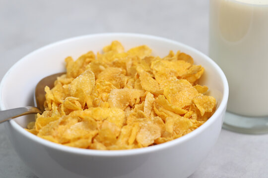 Yellow frosted corn flakes bowl for dry, cereals breakfast. Healthy food.	