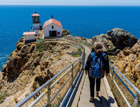 Female Hiker Descending The Steep Stairs to the Pt. Reyes Lighthouse, Pt. Reyes National Seashore, California, USA