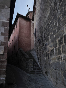Albarrac&iacute;n medieval alley with stone steps and historic walls