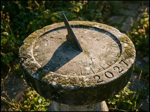 Stone Sundial Casting a Shadow Across Its Numerals