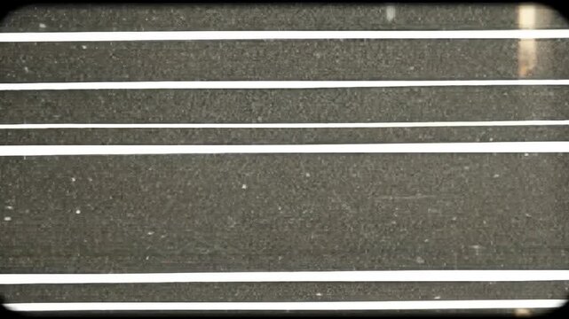 Abstract video of parallel lines and shapes with a dark background.