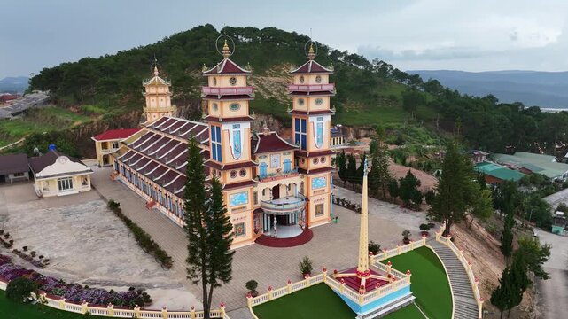 Orbit drone shot of Cao Dai Temple of Da Lat, Dalat, Lam Dong, Vietnam.