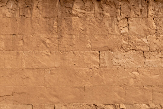 Rammed earth wall with layered lift courses