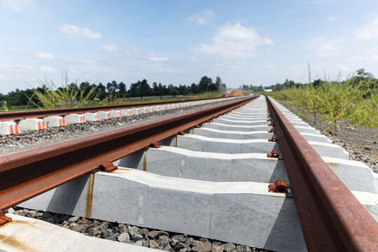 Unfastened Railway Rails on Concrete Sleepers Awaiting Installation of Rail Clips