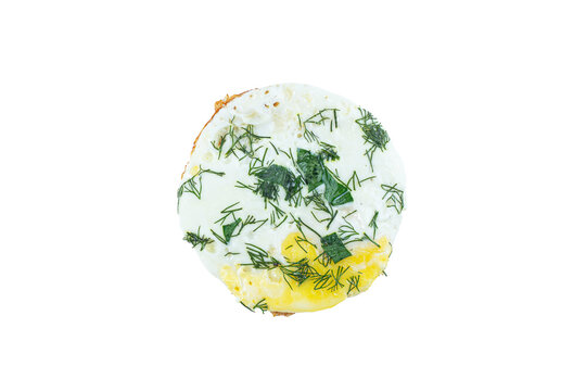 Top view of fried egg with fresh dill and herbs isolated on white background. Healthy breakfast, organic food and cooking ingredient concept.