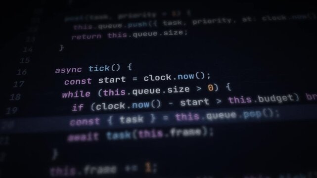 Computer screen showing scrolling JavaScript source code for software development and programming.