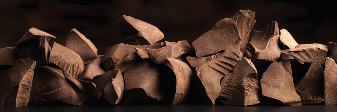 heap pieces chocolate, sweet dessert of dark bars