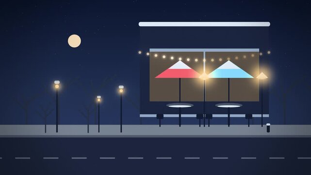 Blue cafe terrace with patio heaters on snowy city street at night