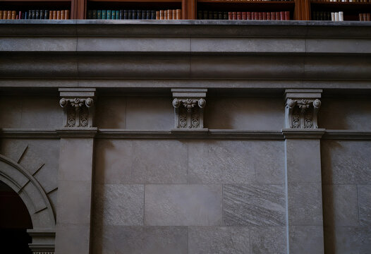 Academic heritage and classical architecture, stone wall with ornate corbels and library bookshelves in a historic university building interior
