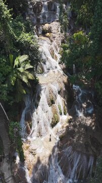 Aerial view of a tourist at rantepao waterfall in sulawesi