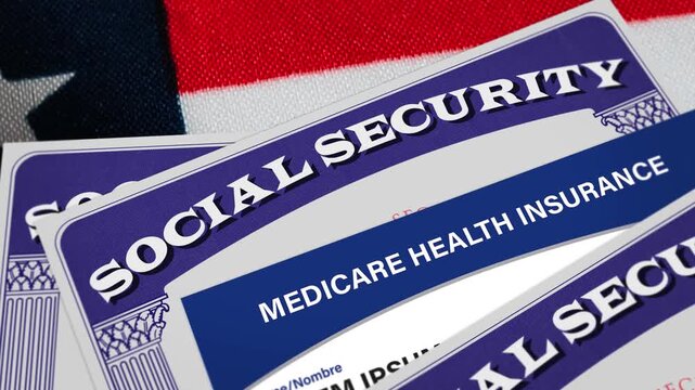 Social security benefits card with Medicare Health Insurance card close up on the American flag. Healthcare, retirees, old people, disabled workers concept. 4k video