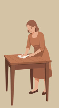 Woman wiping a wooden table with a cloth