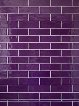 Abstract purple and dark grey brick wall texture with neon lighting