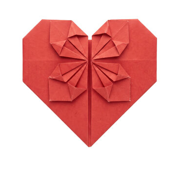 Red origami paper heart with intricate folded details isolated against a black background