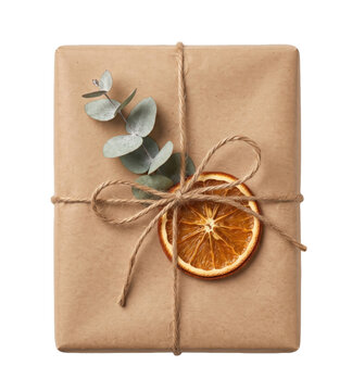 Rustic kraft paper gift wrapped with twine, dried orange slice, and eucalyptus sprigs