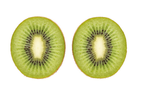 Two fresh kiwi halves showcase vivid green flesh and concentric black seeds on a dark background