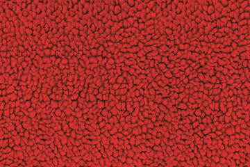 A full-frame, detailed close-up shot of soft red sherpa fleece fabric, showing a fuzzy, curly teddy bear texture from a top-down view. Concept of warmth, comfort, cozy textile © DariaR