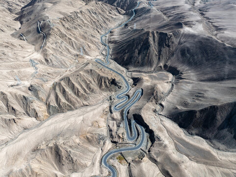 Aerial view of the winding Panlong Ancient Road in Xinjiang mountains