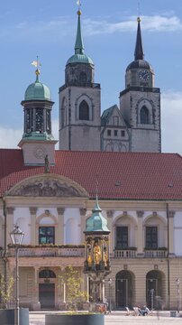 Alter Markt (Old Market Square) in Magdeburg, Saxony-Anhalt, Germany, City Hall and Magdeburg Rider, front view time-lapse with motion blur of people 