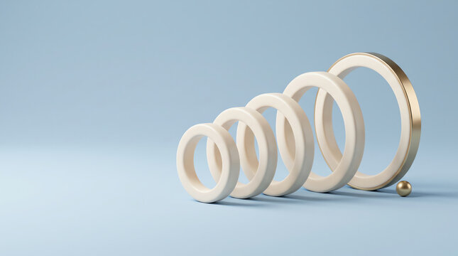 A collection of iridescent shell rings arranged in a staggered line on a pale surface