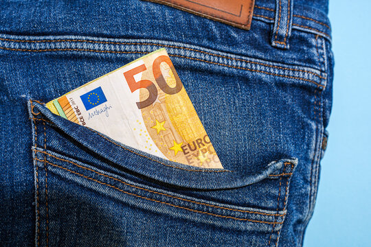 50 euro banknote in back pocket of blue denim jeans