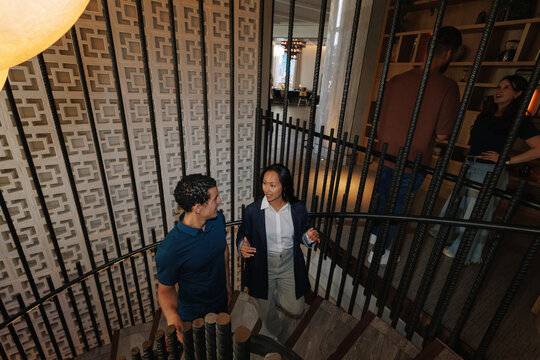 Business people having conversation on office staircase