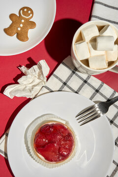 Christmas Table With Gingerbread Man, Cocoa and Tasty Strawberry Tart