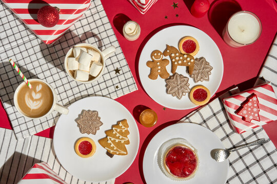 Christmas Table With Gingerbread Cookies, Coffee, Gifts and Candles
