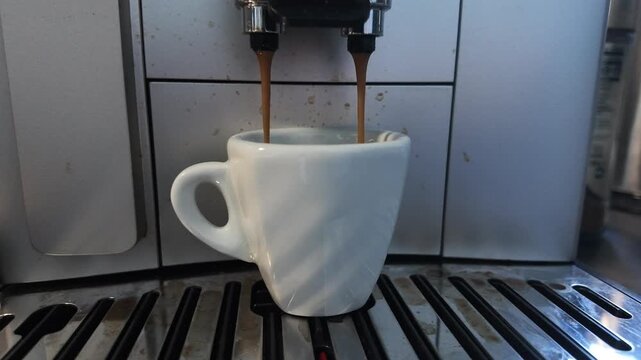 Making espresso in a coffee machine in a kitchen setting