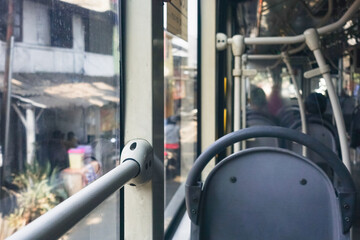 Inside a TransJakarta bus in Jakarta, Indonesia, showcasing the city’s public transportation system and everyday urban commuting © krisbiantography
