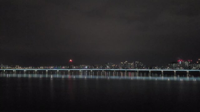 Night View of Han River and City Lights Seen from Moving Car Window on Bridge