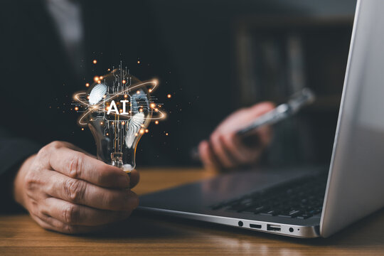 Businessman holding glowing AI light bulb with digital circuit, representing artificial intelligence innovation, creative technology idea, and smart business solution on office desk.