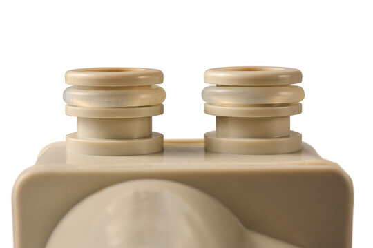 plastic pipe fittings with rubber washers isolated white background, beige plumbing connectors with sealing rings in close-up view