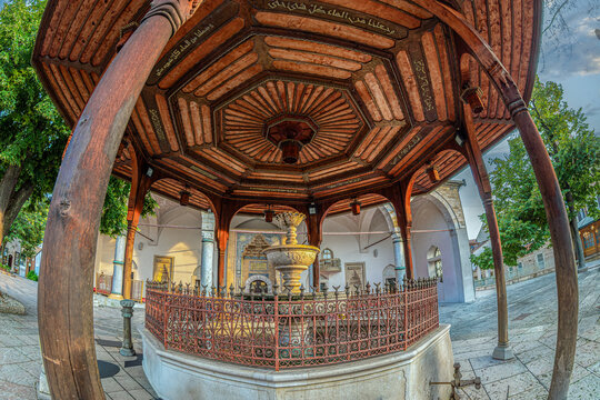 Sarajevo, Bosnia and Herzegovina &ndash; August 24, 2024: The historic shadirvan in the courtyard of Gazi Husrev-beg Mosque, witch dates back to the 16th century (1530) and a ablution fountain in Ba&scaron;čar&scaron;ija